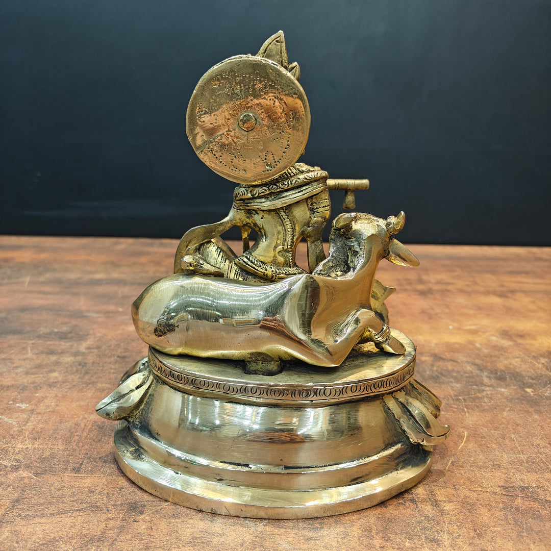 Brass Krishna Idol Seated With Cow On Pedestal 9 Inch