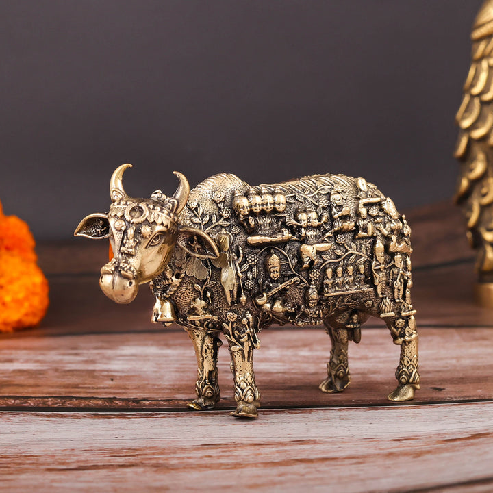 Brass Superfine Kamadhenu Cow with Engraved Gods and Goddesses 4 Inch
