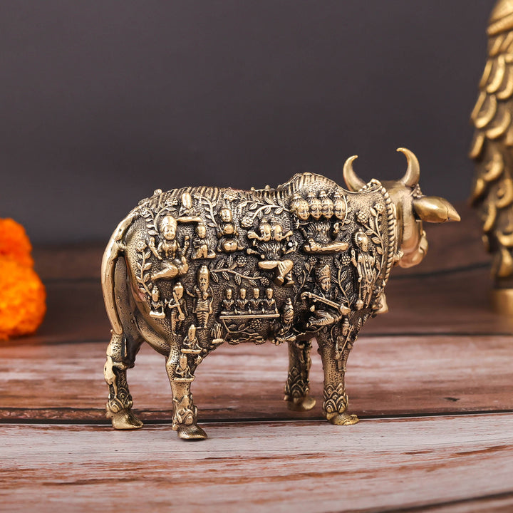 Brass Superfine Kamadhenu Cow with Engraved Gods and Goddesses 4 Inch