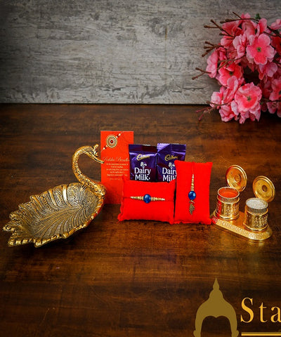 StatueStudio Rakhi Gift For Bhaiya & Bhabhi With Rakshabhandhan Gift Hamper Combo - Lumba Rakhi For Bhaiya & Bhabhi,  Greeting Card, 2 pcs Dairy Milk, Roli Chawal, Metal Duck Tissue Holder, Kum Kum Dabbi