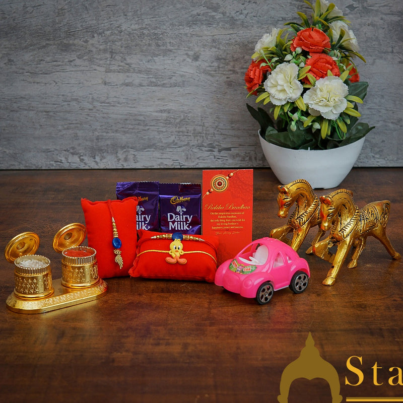 StatueStudio Rakhi Gift For Bhaiya Bhabhi & Kids With Rakshabhandhan Gift Hamper Combo - Lumba Rakhi & Kids Rakhi, Kum Kum Dabbi, Greeting Card, 2 pcs Dairy Milk, Roli Chawal, Toy Car, Metal Horse Pair Showpiece