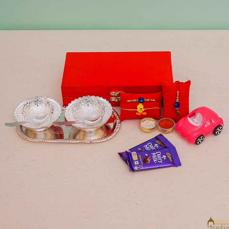 StatueStudio Rakhi Gift For Bhaiya Bhabhi & Kids With Rakshabhandhan Gift Hamper Combo - Lumba Rakhi & Kids Rakhi, Kum Kum Dabbi, Greeting Card, 2 pcs Dairy Milk, Roli Chawal, Toy Car, Pooja Thali & 2 pcs Bowl Tray Gift Set