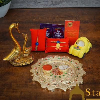 StatueStudio Rakhi Gift For Bhaiya Bhabhi & Kids With Rakshabhandhan Gift Hamper Combo - Lumba Rakhi & Kids Rakhi, Kum Kum Dabbi, Greeting Card, 2 pcs Dairy Milk, Roli Chawal, Toy Car, Pooja Thali & Swan Pair Showpiece